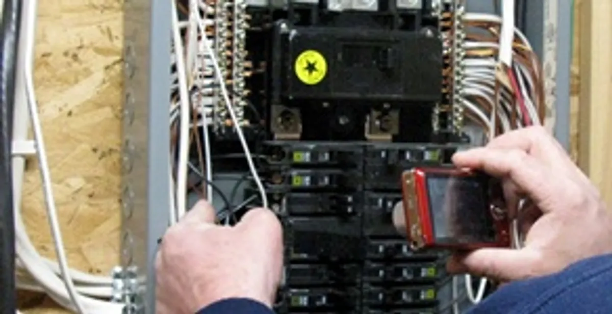 Home electrical inspection of circuit breaker panel by licensed electrician in St Paul, MN