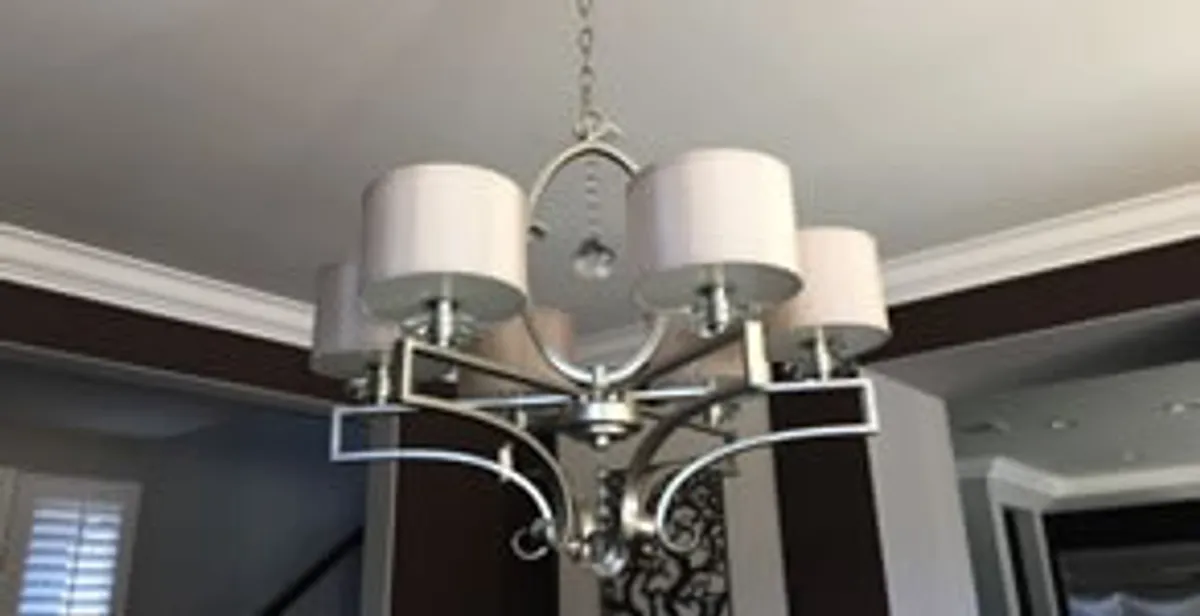 Modern chandelier installation with multiple light fixtures in St Paul, MN