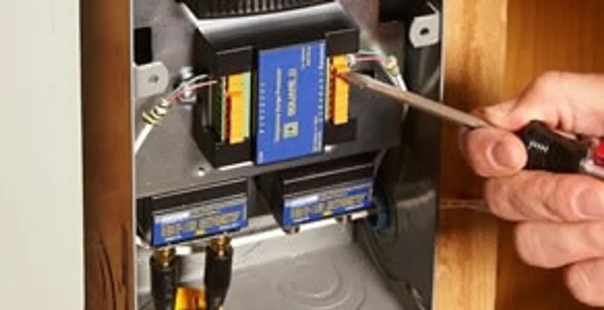 Whole home surge protection device being installed by a licensed electrician to protect electrical systems in St Paul, MN